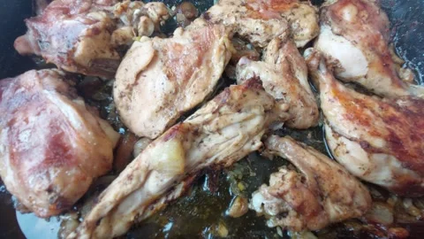 Top view of roasted chicken pieces juicy and sizzling in a baking pan Stock Footage 338282458