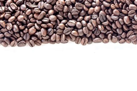 Top view with roasted coffee beans isolated on white table background Fotos de archivo