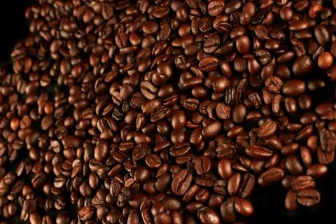 Top view of roasted coffee beans for background and texture. Piled of roasted Stock Photos