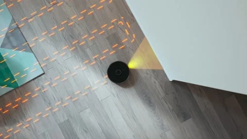 Top view of the robotic vacuum cleaner working. Smart home. Floor cleaning Stock Footage 234308042