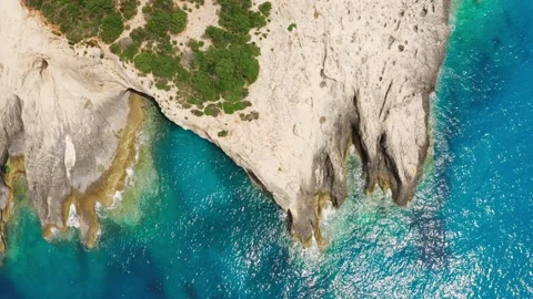 Top view of rocky coastline with cave and turquoise sea water. Stock Footage 156629286