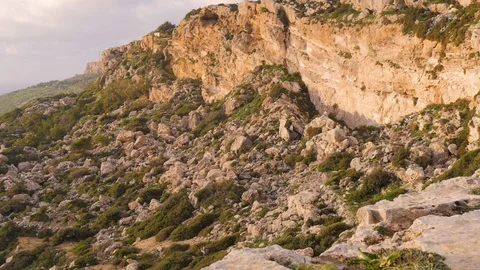 Top view of the rocky terrain and the sea. Green moss, stones, nature, no people Stock Footage 101533628