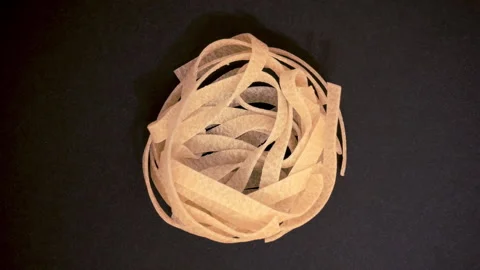 Top view of a roll of noodles with circular zoom effect Stock Footage 147491514