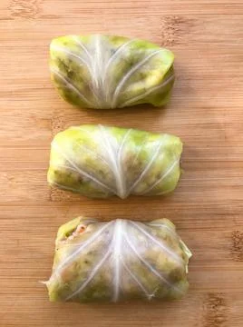 Top view of rolled cabbage leaves stuffed with ground meat, rice and onion on Stock Photos