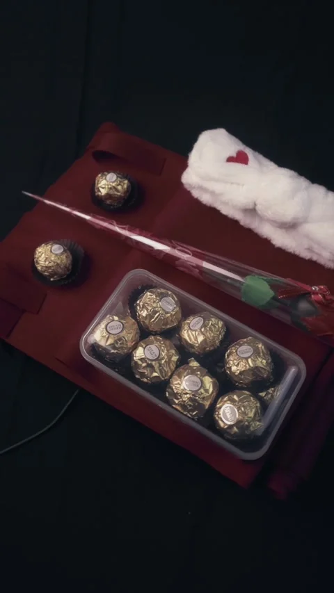 Top View Romantic Gift Set With Gold Chocolates And Rose For Valentine's Day Stock Footage 322607090
