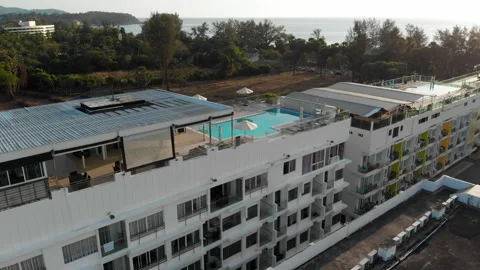 Top view of rooftop pool and sea, Karon landscape, bar, beach, green nature Stock Footage 246968259