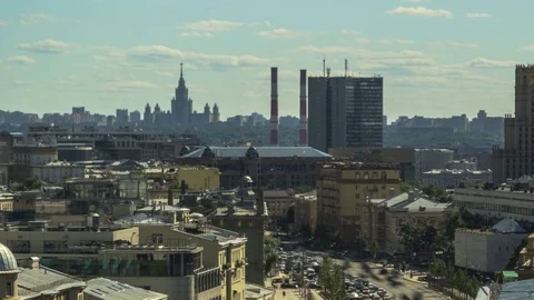 Top view of the rooftops and the traffic on the city streets Stock Footage 76935917