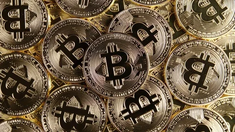 TOP VIEW: Rotating bitcoins - Close up Stock Footage 88264323