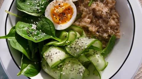 Top View Rotating Bowl with Clean Eating Breakfast and Superfoods Vídeos de archivo 332341950