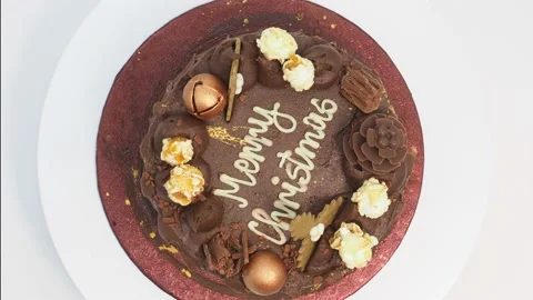 Top View Of A Rotating Chocolate Christmas Cake, On A White Background Stock Footage 228034313
