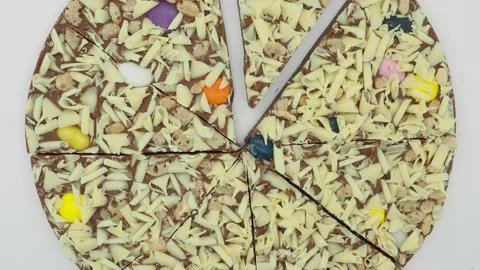 Top View Of A Rotating Chocolate In The Shape Of A Pizza. London, UK Stock Footage 133195977