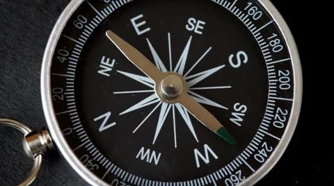 Top view of rotating compass with flickering pointer Stock Footage 980826
