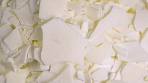 Top view of rotating dry soy textured wax flakes, highlighting plant texture Stock Footage 329100553