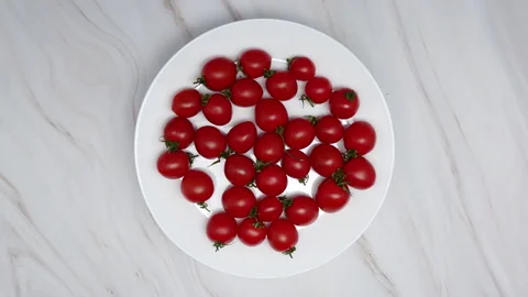 Top View Of Rotating Fresh Red Cherry Tomatoes On A White Plate. Cherry Tomatoes Stock Footage 151260986