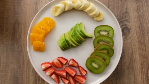 Top view of rotating fruit plate Stock Footage 272307339