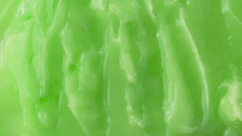 Top view of rotating green body cream or seaweed mask. Cosmetic texture spi.. Stock Footage 317316576