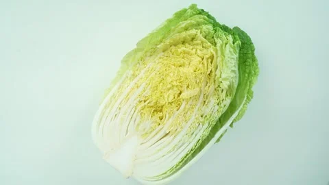 Top View Rotating Napa Cabbage on White Background Stock Footage 335184859
