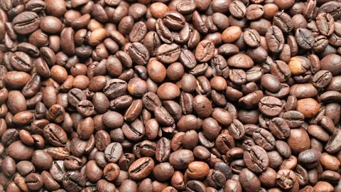 Top view  of rotating roasted  coffee grains Stock Footage 141287374