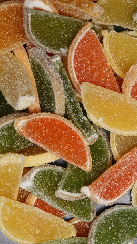 Top View Of Rotation Of Sweet Colored Slices Of Marmalade In The Form Of Lemon S 스톡 동영상 268106074