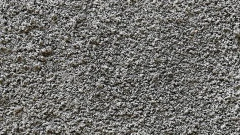 Top view of rough gray granular concrete wall texture Stock Photos