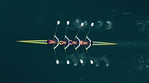 Top View Of Rowing Boat With Four Women On Calm Ocean At Golden Sunrise Stock Footage 317995404