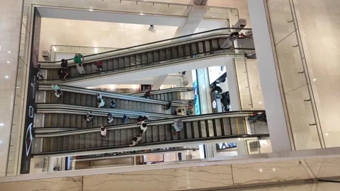 Top view of running of four escalators Stock Footage 274768591
