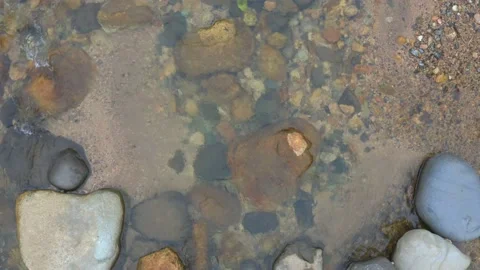 Top view of running water in a riverbed Stock Footage 151278448