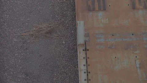 Top View of Rusted Freight Railcar and Gravel Ballast Texture Video stock 333081239