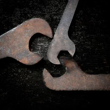 Top view of the rusty and old wrenches put on the grunge table surface Stock Photos