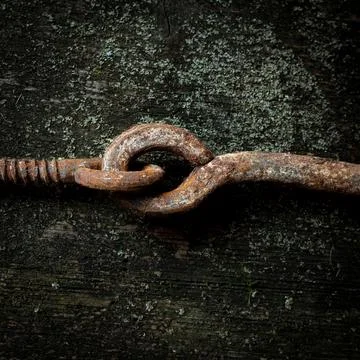 Top view of the rusty and old chain put on the grunge table surface Stock Photos