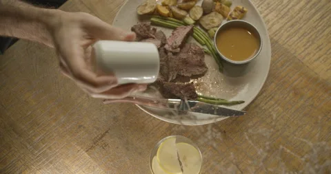 Top view salted cooked beef steak. Video in slow motion in 4K Stock Footage 103682511