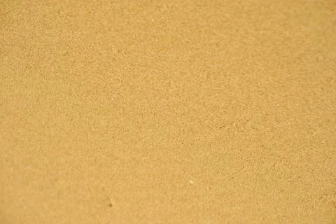 Top view of sandy beach. Background with copy space and visible sand texture. Stock Photos