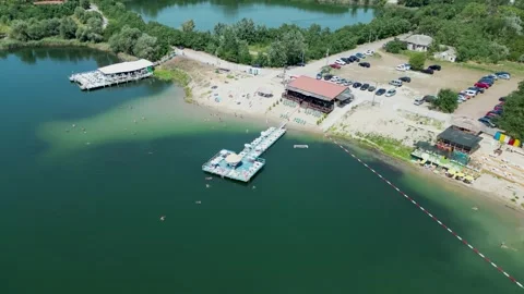 Top view of a sandy beach full of people on the lake. Video stock 255919415