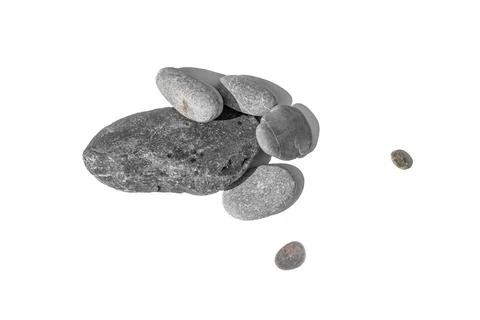 Top view of scattered grey river pebbles with sharp shadows isolated Stock Photos