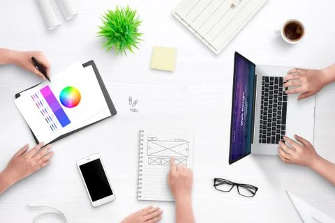Top view scene of web design team work desk. Laptop computer with flat design Stock Photos