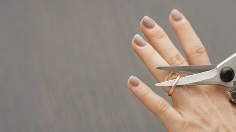 Top view scissors cutting wedding ring. High quality and resolution beautiful Stock Photos