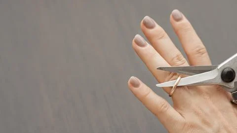 Top view scissors cutting wedding ring. High quality and resolution beautif.. Stock Photos