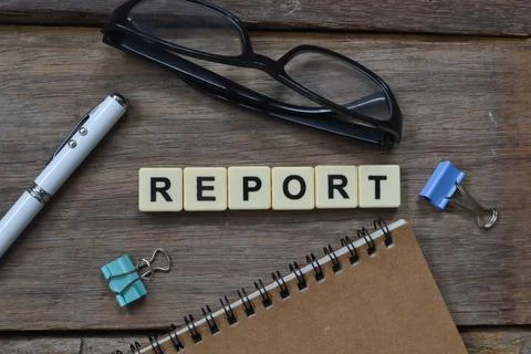 Top view of scrabble letters with text REPORT. Stock Photos