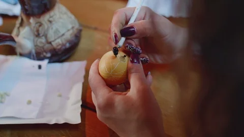 Top view of scratching the pattern on easter egg Stock Footage 115053288