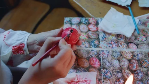 Top view of scratching the pattern on easter egg by little boy Stock Footage 115053387