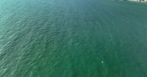 Top view of sea ocean surface with shiny sun reflection on top of water  Stock Footage 245465783
