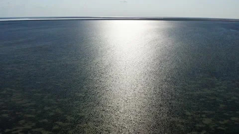 Top view of the sea. The rays of the sun are reflected in the sea water. Stock-Footage 169276308