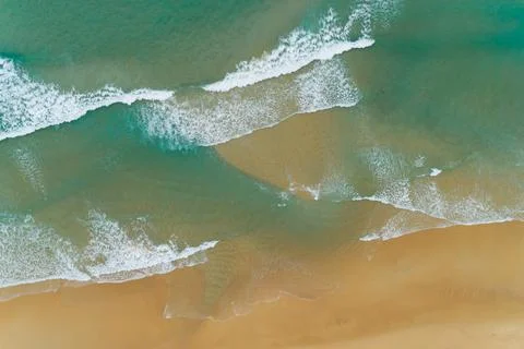 Top View of the Sea texture waves Foaming and Splashing on beach Beautiful wa Stock Photos