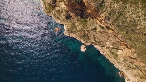 Top view of the sea with waves and sea cliff Stock Footage 240637337