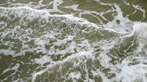 Top view of sea waves on cloudy day. Slow motion 動画素材 164943371