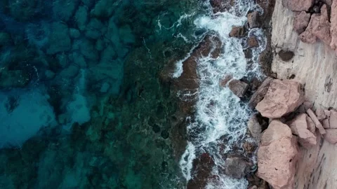 Top view sea waves crash on rocky shore Stock Footage 168704990