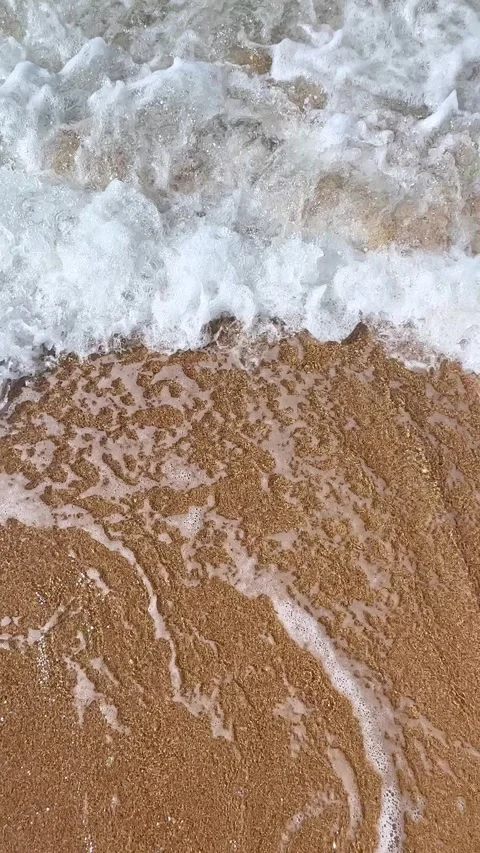 Top view sea waves with foam near sea or ocean shore. Slow motion footage Stock Footage 305875570