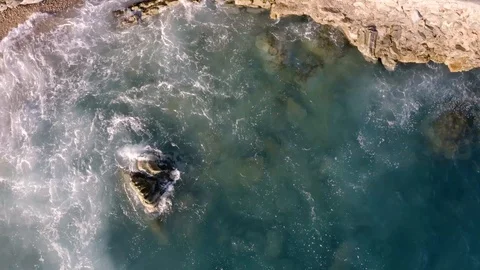Top view of sea waves hitting on the rocky coast Stock-Footage 122063638