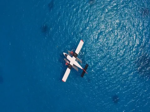 Top view of seaplane at parking. Rotating camera shot of the hydroplane in ocean Video stock 76719311