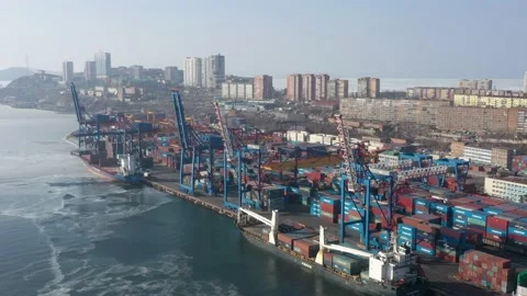 A top view of the seaport container terminal and city. Stock Footage 169750571